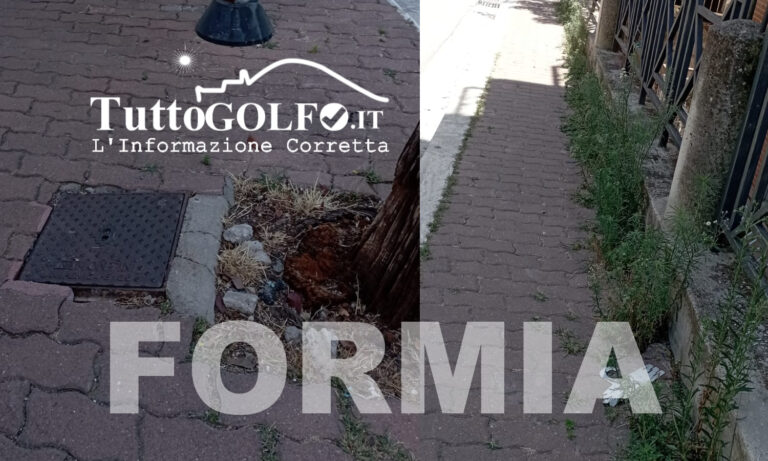 Formia, via Don Luigi Sturzo: erba alta e tombino pericoloso a pochi passi dalla scuola