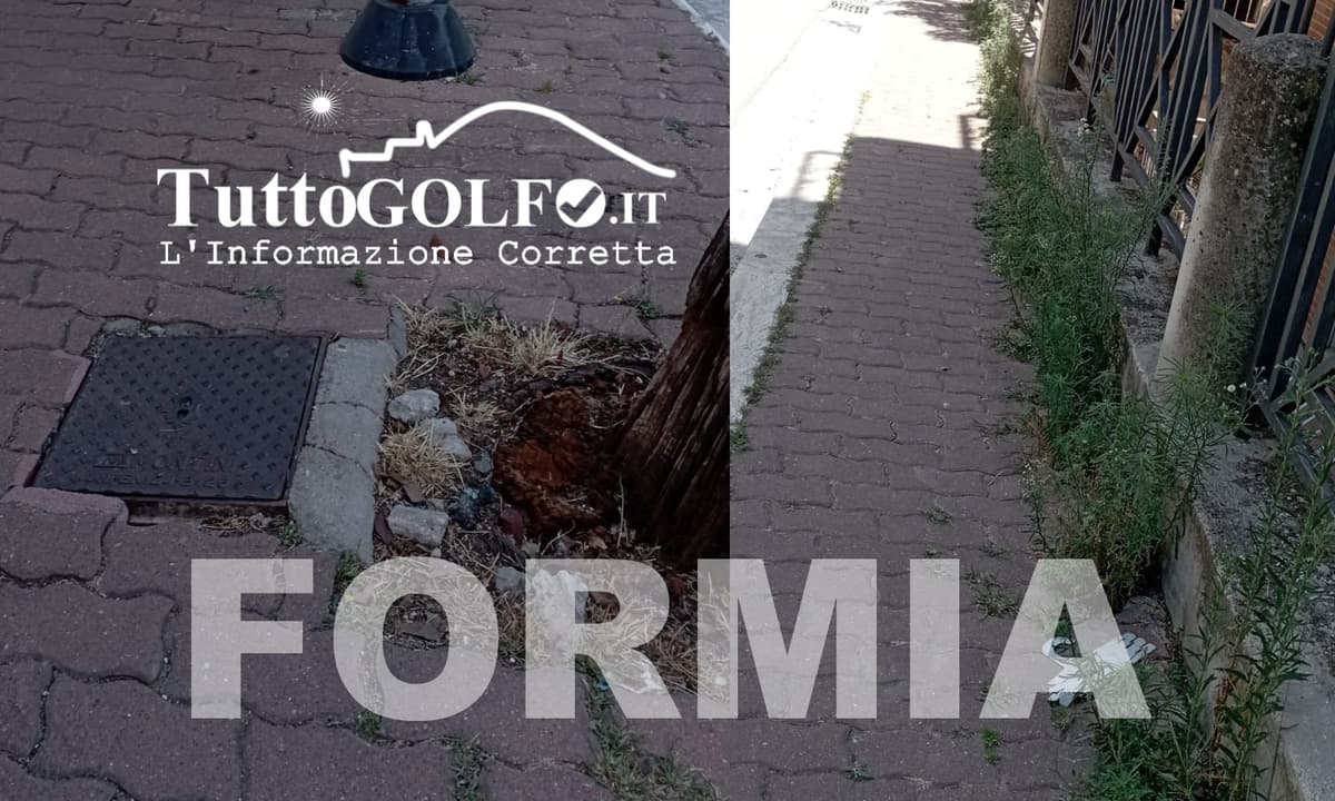 Formia, via Don Luigi Sturzo: erba alta e tombino pericoloso a pochi passi dalla scuola